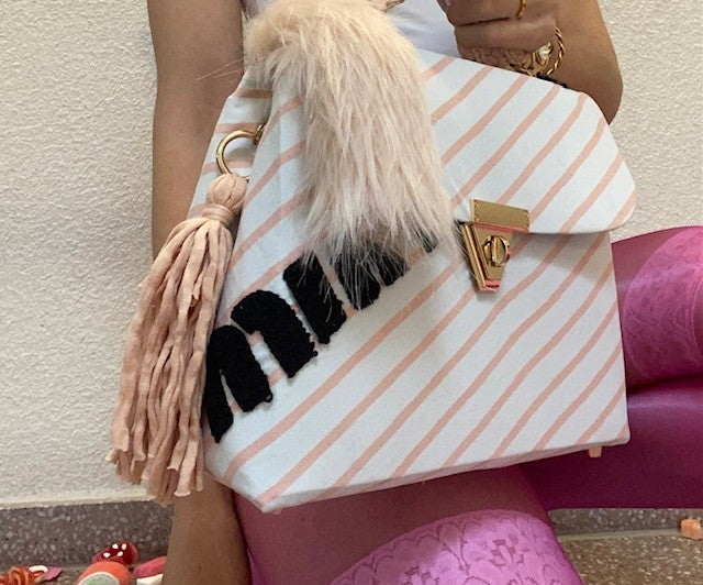 A SIGNATURE STRIPED RITZY HAZE BAG