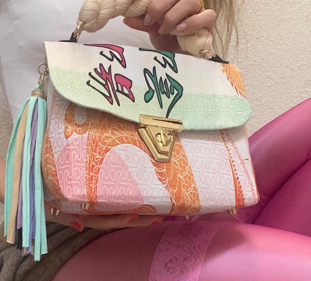 A SIGNATURE DRAGON RAINBOW BAG