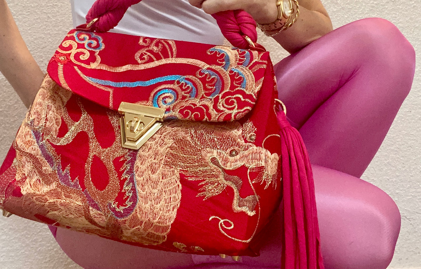 A SIGNATURE GOLDEN EMBROIDERED PHOENIX BAG