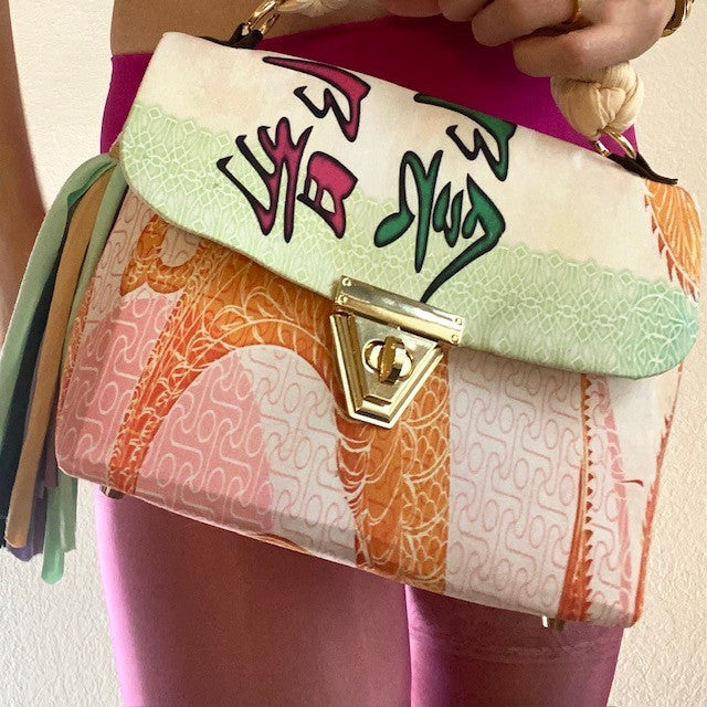 A SIGNATURE DRAGON RAINBOW BAG
