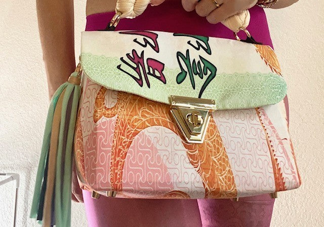 A SIGNATURE DRAGON RAINBOW BAG