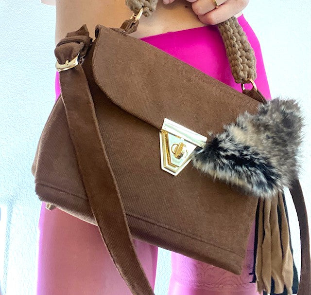 A SIGNATURE CHARLY BROWN CORDUROY BAG