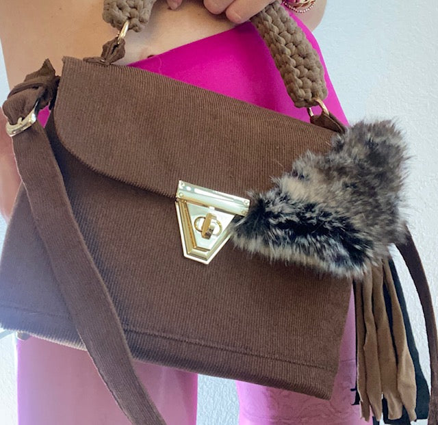 A SIGNATURE CHARLY BROWN CORDUROY BAG