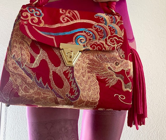 A SIGNATURE GOLDEN EMBROIDERED PHOENIX BAG