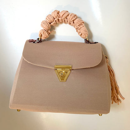 A SIGNATURE NUDE HAZE GLAM BAG